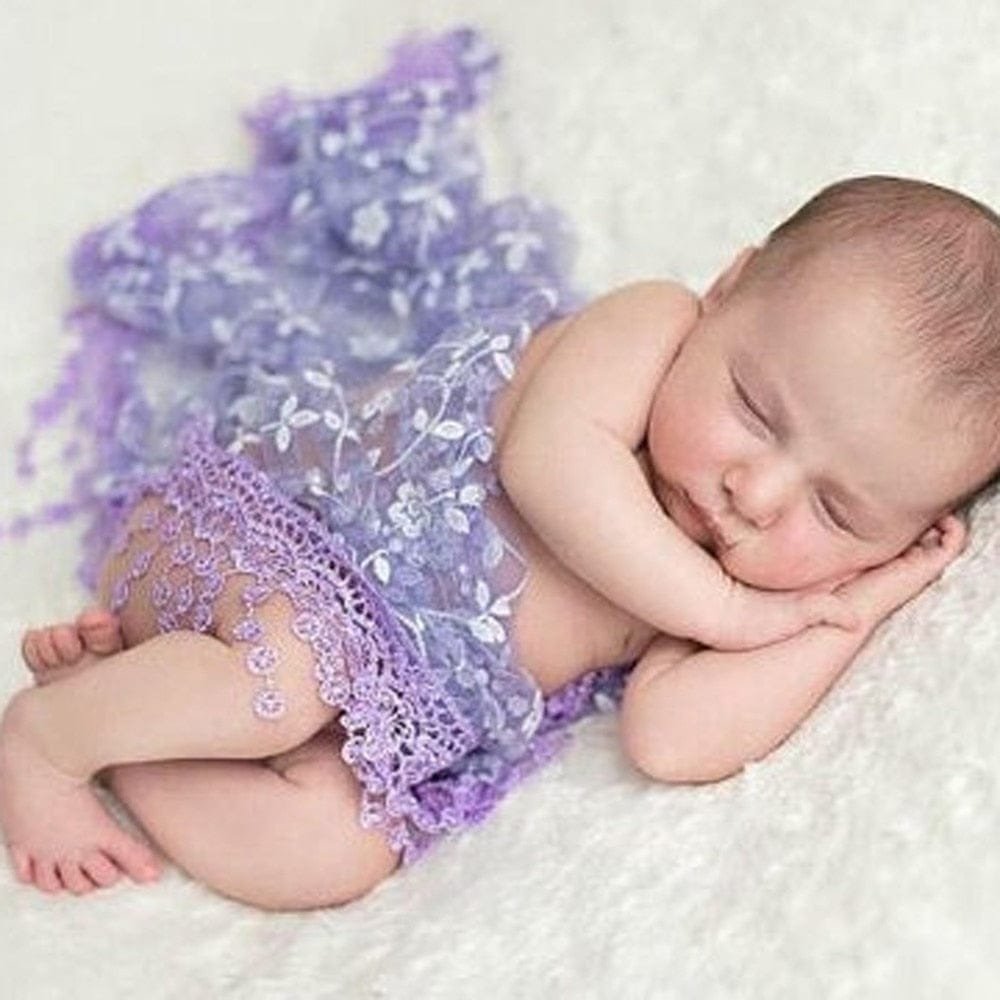 Newborn purple lace wrap blanket used as a baby photo prop for studio portraits and newborn shoots.