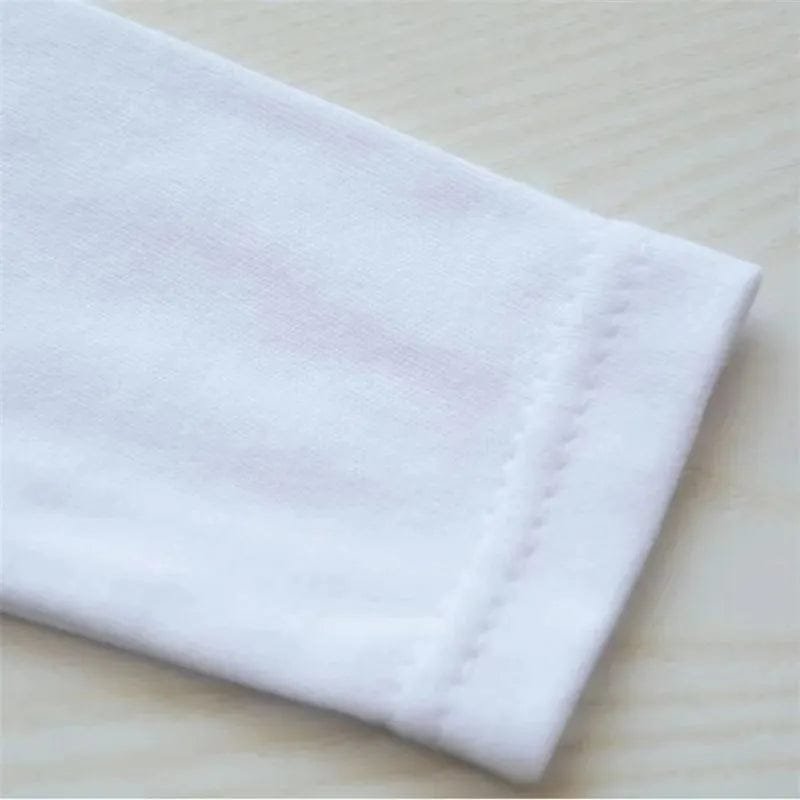 Close view of the soft cotton fabric used in the newborn letter print romper for gentle all-day comfort on baby skin.