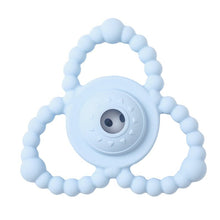 Light blue teething ring with a circular design.