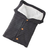 Dark gray knitted vest with brown buttons
