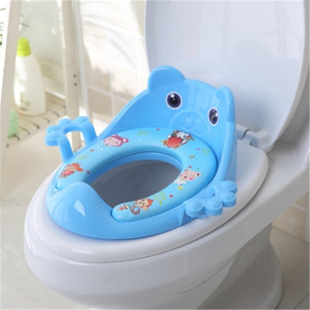 Blue children's toilet seat with cartoon design on a white toilet. (option 2)