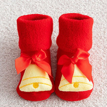 Non-slip Cotton Kids Socks in red booties with white bell design and bows for toddler holiday dressing.