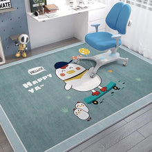 Children's room with a blue chair on a rug featuring cartoon penguins.