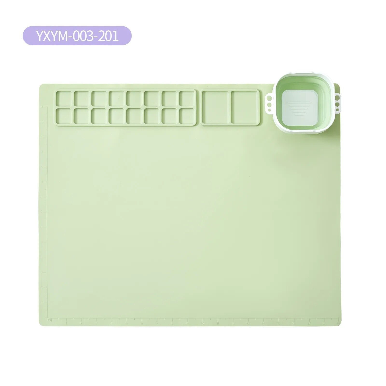 Light green silicone mat with multiple compartments.