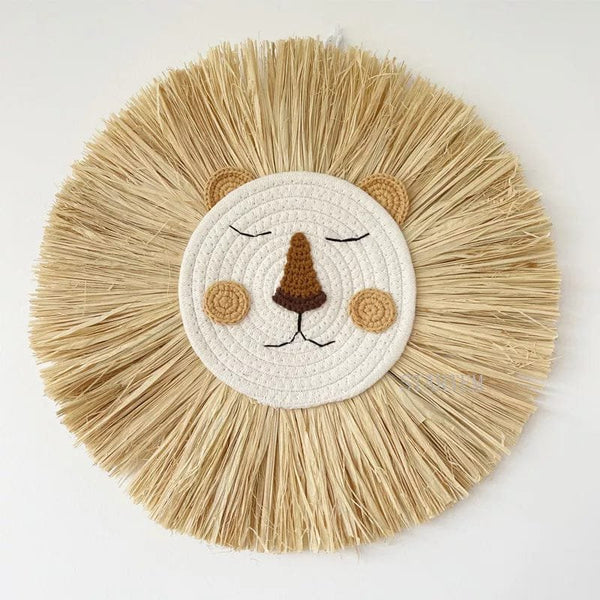 Nordic handmade lion wall decor in woven cotton and straw for nursery walls and boho kids room styling.