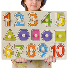 Child holding a Montessori wooden number puzzle board with numbers 1 to 10 for fine motor training.