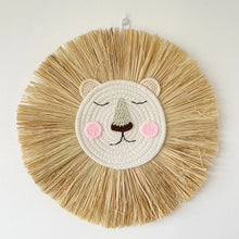 Nursery lion wall decor with raffia mane detail for handmade, natural-textured baby room decoration.