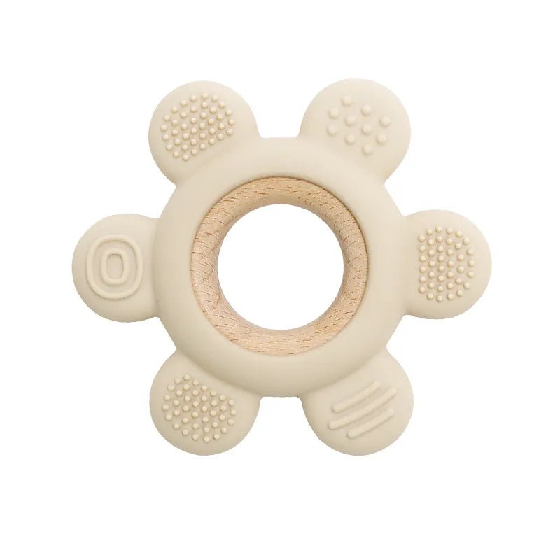 Beige teething ring with wooden center.