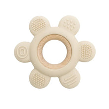 Beige teething ring with wooden center.