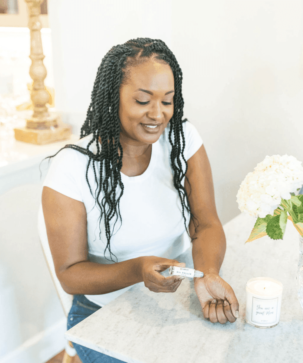 Oil Roller Duo essential oil roller being applied to the skin for calming, stress relief, and self-care moments.