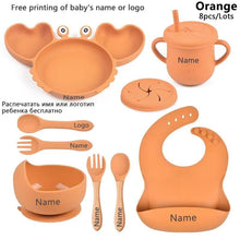 Orange baby crab dining set with suction bowl and plate to keep toddler feeding tidy and mess-free.