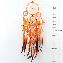 Orange feather rattan dream catcher pictured with measurement guide for gifting and decor.