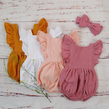 Organic cotton baby girl romper and headband sets displayed together for everyday wear, gifting, and newborn photo sessions.
