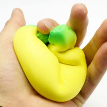 Oversized Squishy Banana Toy held in hand as a slow rebound fidget for stress relief play.