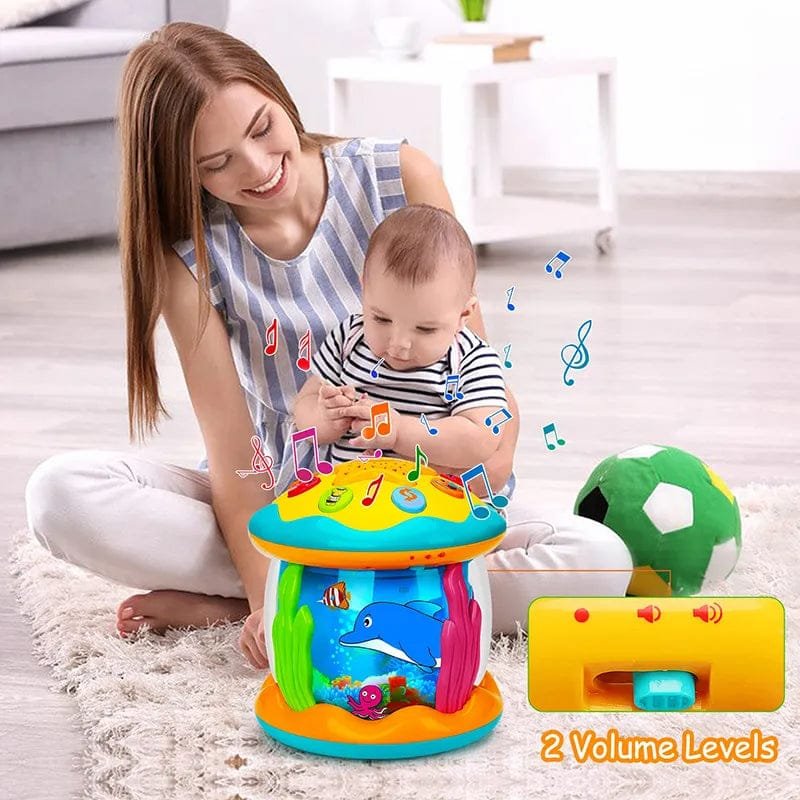 Parent and baby playing with the ocean light projector toy for bonding, tummy time, and sensory play.