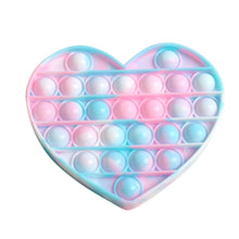 Pastel heart shaped push pop bubble sensory toy for calming stress relief play.