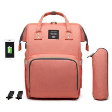 Peach USB Mummy Maternity Nappy Bag extra large backpack for nappies, bottles, and changing kit on family trips.