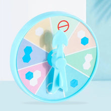 Close-up of the colorful round spinner with a blue pointer