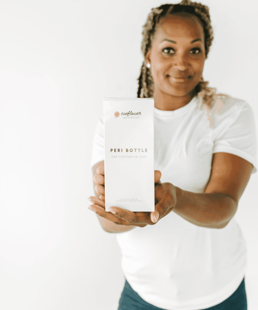 Peri Bottle packaging held by a new mother, a practical postpartum recovery gift for baby showers and hospital bags.