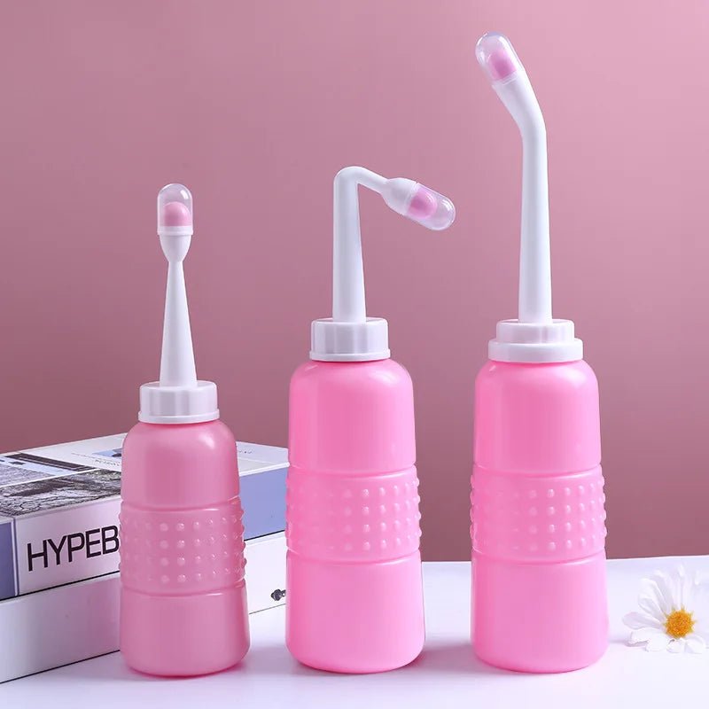 Three pink Peri Bottles shown together as a postpartum and perineal cleansing aid set.