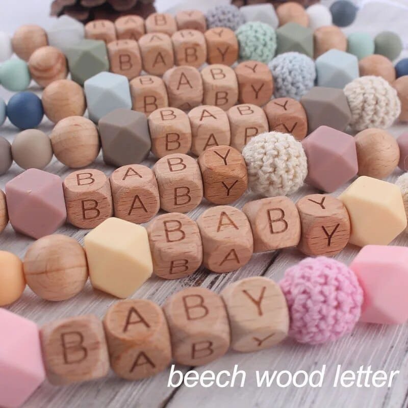 Personalised beaded dummy clip chain with teether toy to stop pacifiers falling during pram outings and playtime.