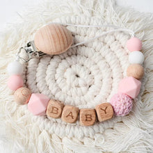 Colour seven of the personalised teething clip set for newborn babies during feeds, naps and stroller walks.