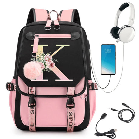 Pink and black backpack with floral design, smartphone, headphones, and USB cable.