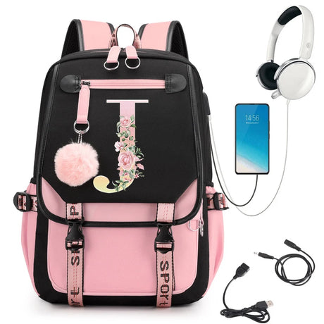Pink and black backpack with floral letter 'J' design, smartphone, headphones, and USB cable.