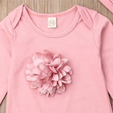 Pink baby onesie with large flower applique detail, a soft cotton jumpsuit for everyday newborn comfort.