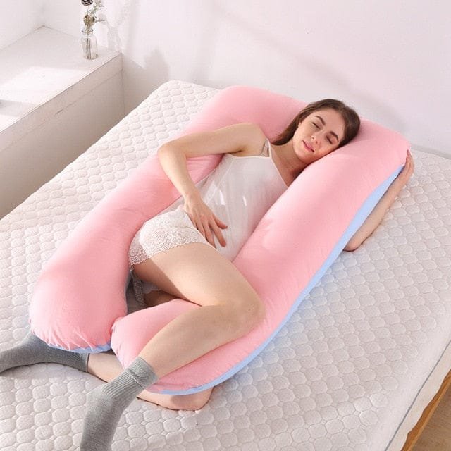 Sleeping Support Pillow in pink and blue two tone for pregnant women needing full body sleeping support.