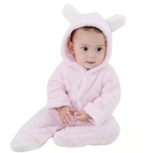 Pink bunny ear baby romper in fluffy fabric for winter outings and playful dress-up moments.