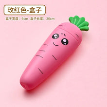 Pink carrot-shaped baby tableware container with a smiling face for playful mealtime.