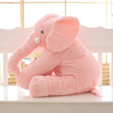 Pink elephant plush toy baby cushion displayed on a white surface for nursery styling and nap support.