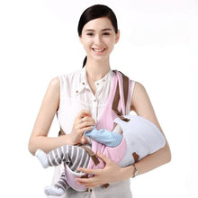 Pink ergonomic front facing baby carrier for comfortable infant carrying during walks and outings.