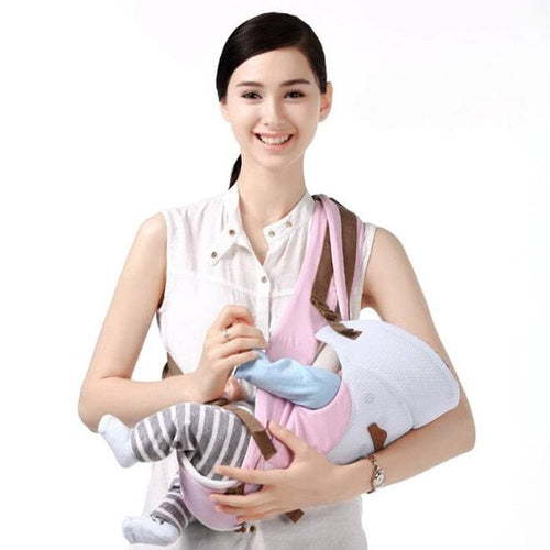 Pink ergonomic front facing baby carrier for comfortable infant carrying during walks and outings.