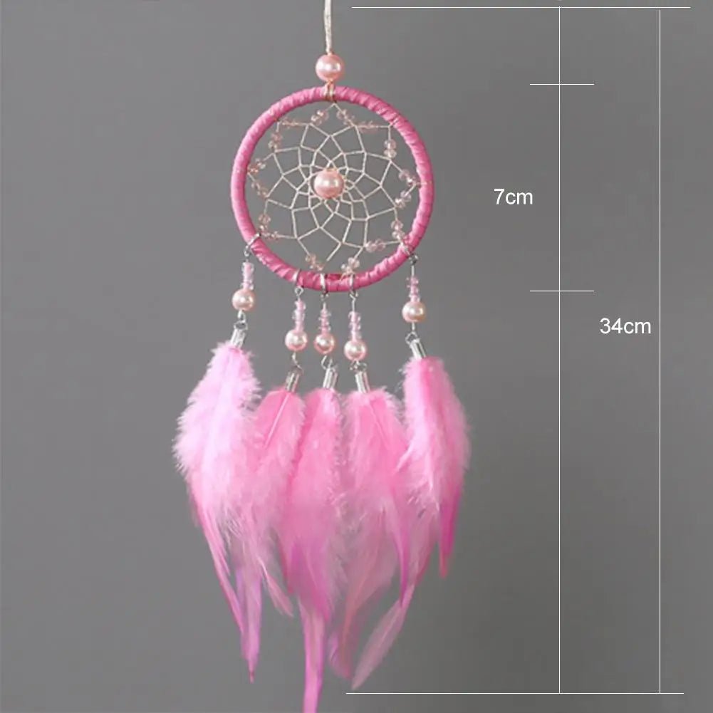 Pink feather dream catcher with boho chic styling and measurement details for wall decor.