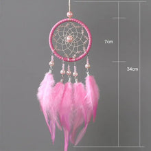 Pink feather dream catcher with boho chic styling and measurement details for wall decor.