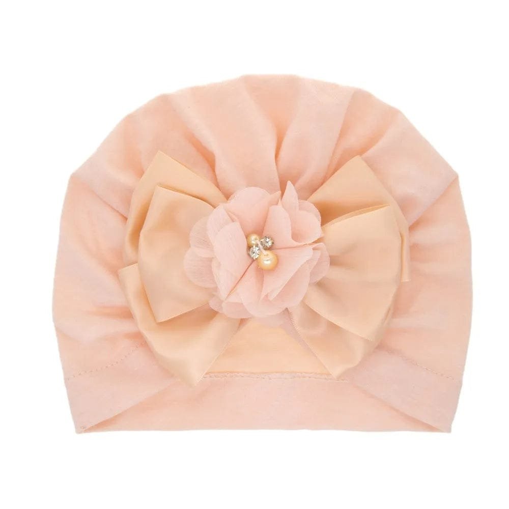 Pink floral and pearl embellished baby turban cap for special occasions, gifting, and dressy baby outfits.