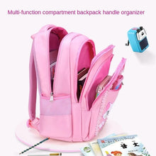 Open compartments of the pink girls backpack showing storage for books, folders, and stationery at school.