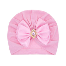 Pink large bow baby turban in soft cotton for keeping little heads cosy during outings and photo days.
