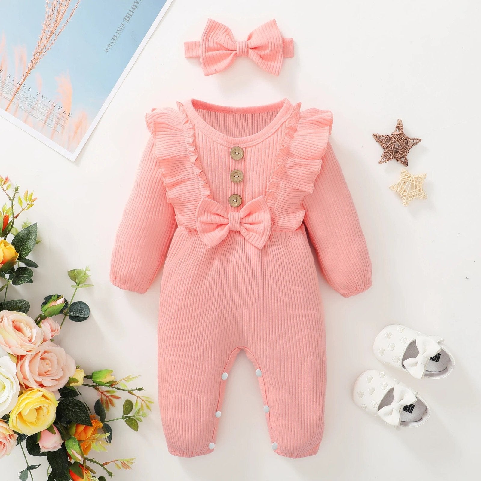 Pink long-sleeve baby romper and headband set for 0-3 month newborns at home and on outings.