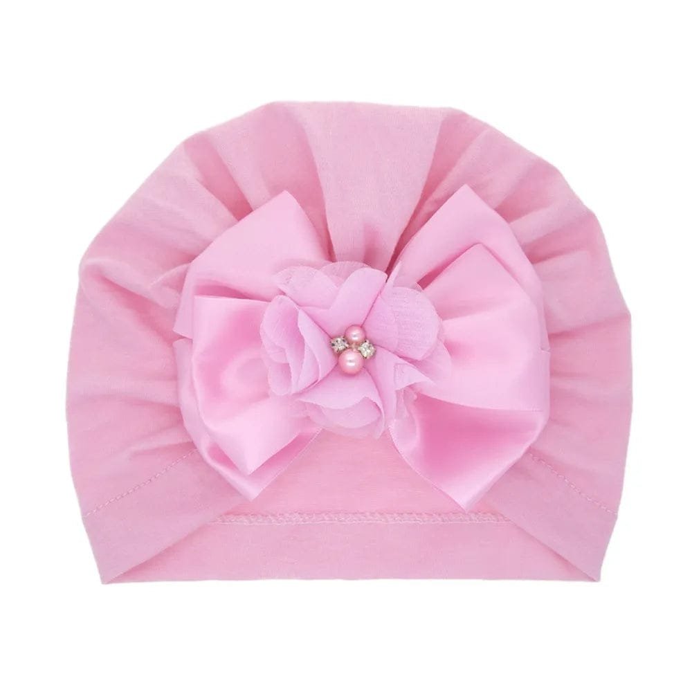 Pink pearl bow baby turban in soft stretch cotton for comfortable all-day wear and dressed-up outings.