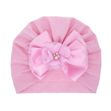 Pink pearl bow baby turban in soft stretch cotton for comfortable all-day wear and dressed-up outings.
