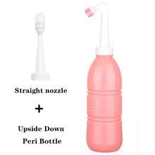 Pink peri bottle with pump attachment that works upside down for easy postpartum rinsing at any angle.