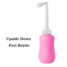 Pink peri bottle with white nozzle for gentle perineal washing during recovery and daily postpartum hygiene.