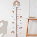 Pink Rainbow Kids Growth Chart wall sticker mounted in a nursery for tracking a childs height as they grow.