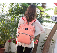 USB Interface Diaper Bag pink backpack with bottle pockets and a wet-dry section for nappy changes.