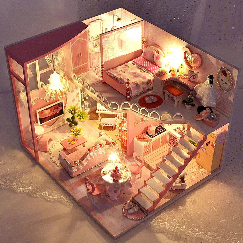 Detailed wooden miniature dollhouse with pink and white interior furniture for finished-build showcase.