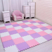 Pink, white, and purple EVA foam puzzle mat set up as an indoor play space for kids.