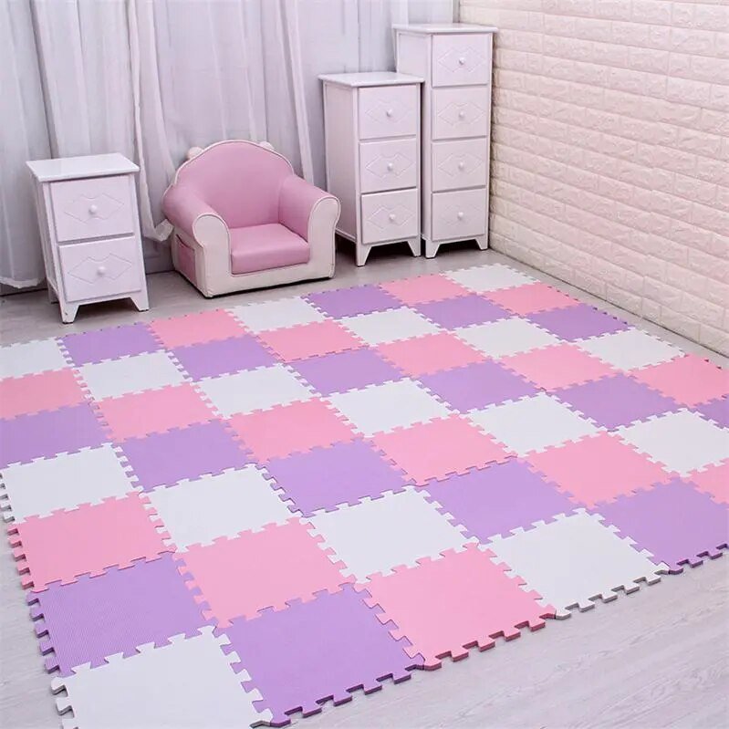 Pink, white, and purple EVA foam puzzle mat set up as a dedicated kids play zone.